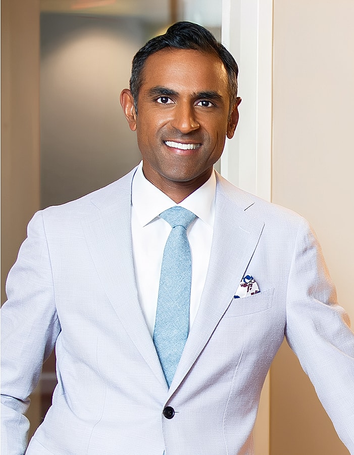 Professional man in light suit and tie.