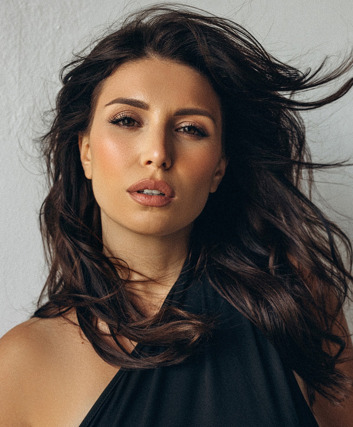 Close-up of a woman with soft makeup.