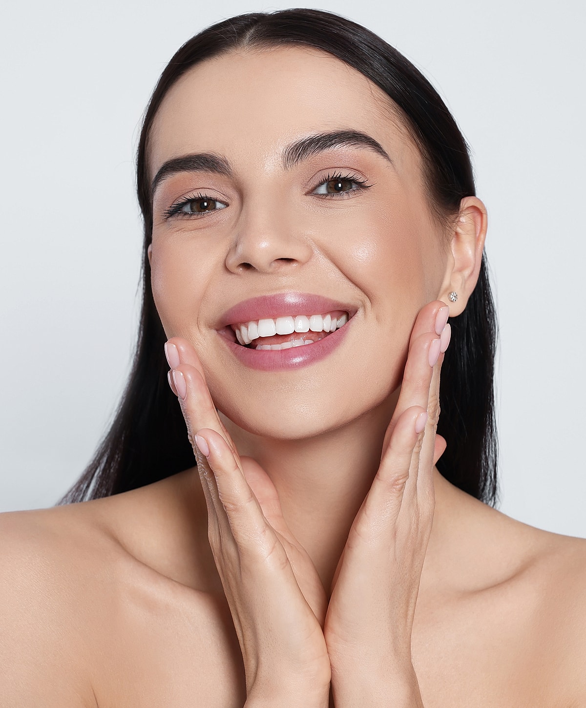 Close-up of a woman with soft makeup.