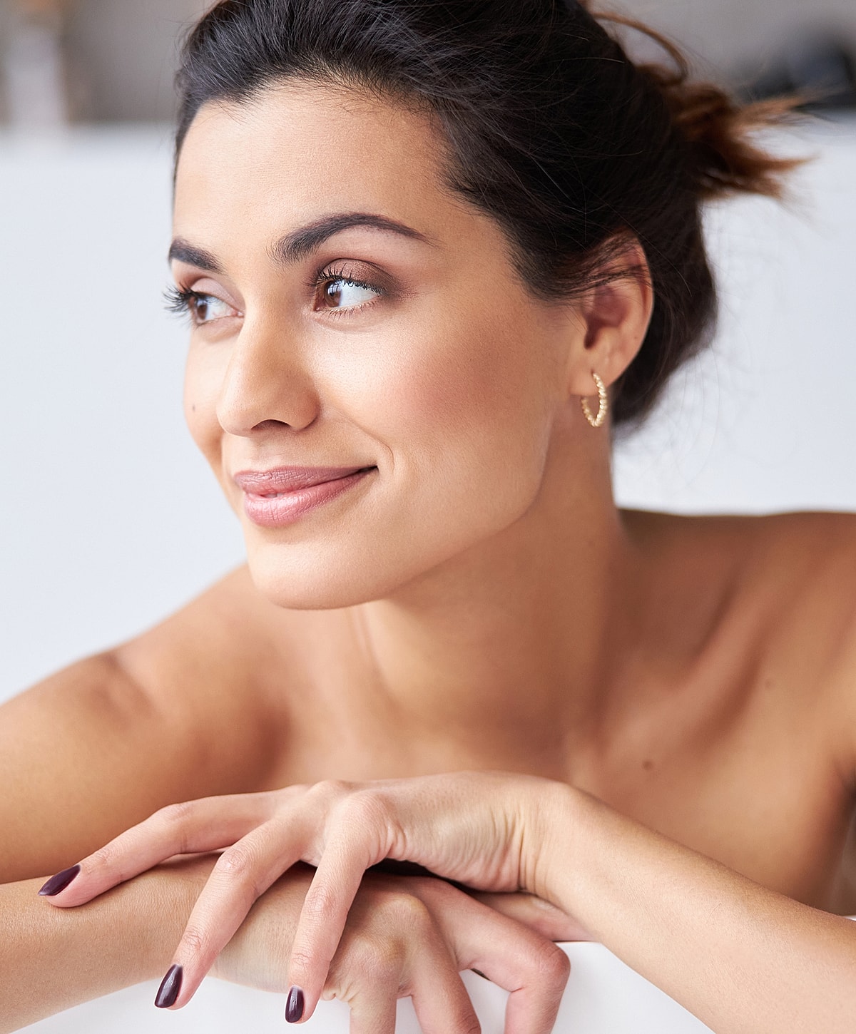 Close-up of a woman with soft makeup.
